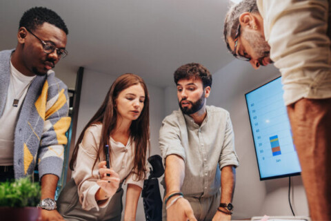 Comprehensive-Marketing-Strategy-Team-around-a-table-talking-about-strategy