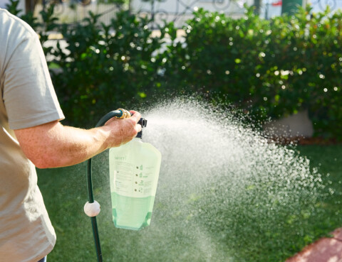 Lawn Care Tips_ Managing Lawns in Drought-Prone Areas _ man watering the lawn