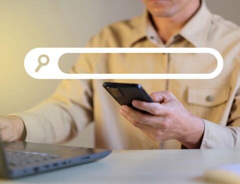 Search-Engine-Optimisation-Service-Man-searching-for-keywords-on-phone