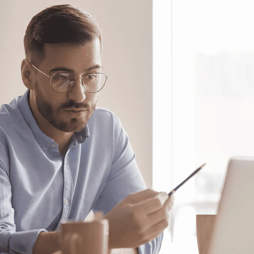 In-the-Trenches-podcast-Businessman-looking-at-laptop-data