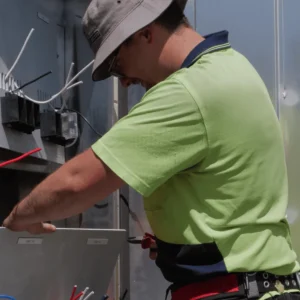 Strata-Power-Electrician-maintaining-switchboard