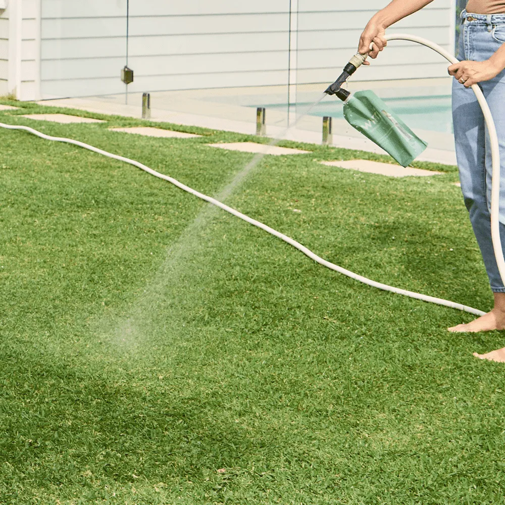 Australian-Lawn-Care-Lady-using-a-lawn-care-product